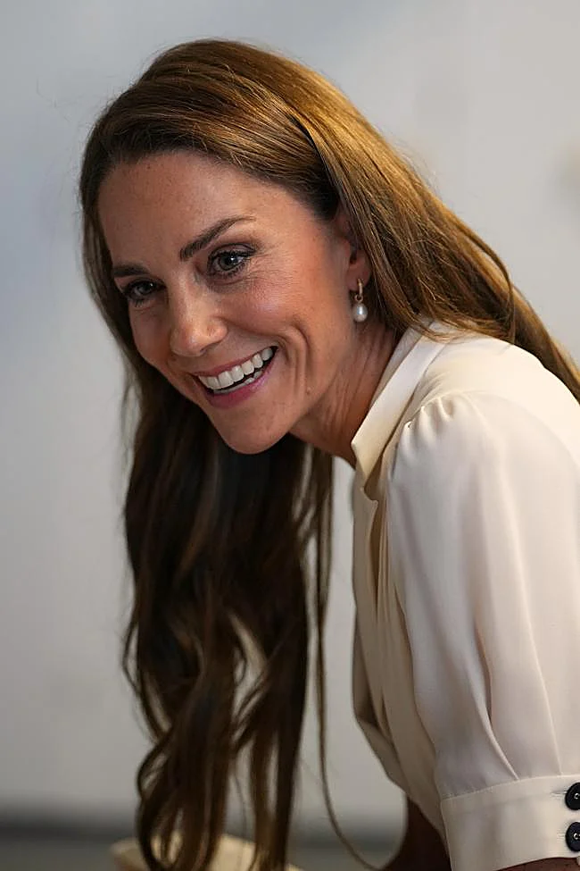 Kate Middleton avec des reflets dans les cheveux.